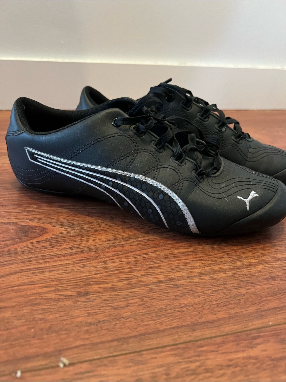 Puma Women's Black Sneakers with Silver Stripe